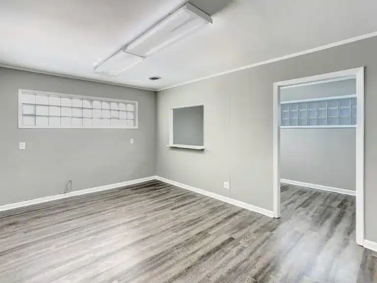 a large empty room with a wooden floor