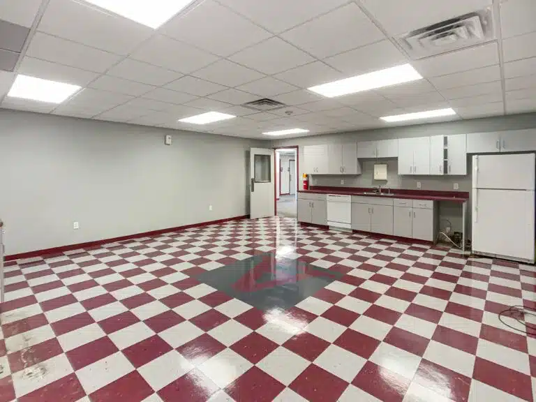 a kitchen with a tile floor