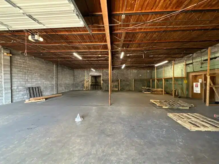 an empty parking lot in front of a building