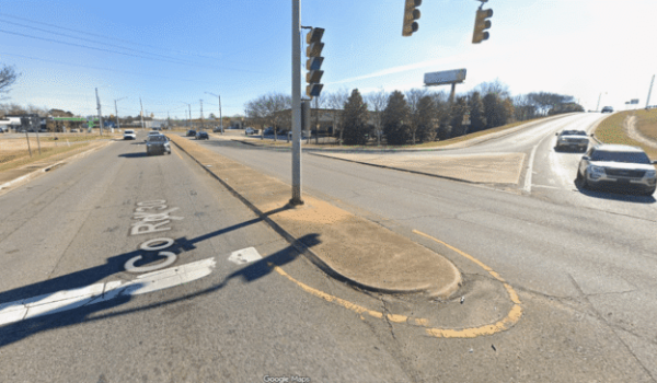 a traffic light sitting on the side of a road